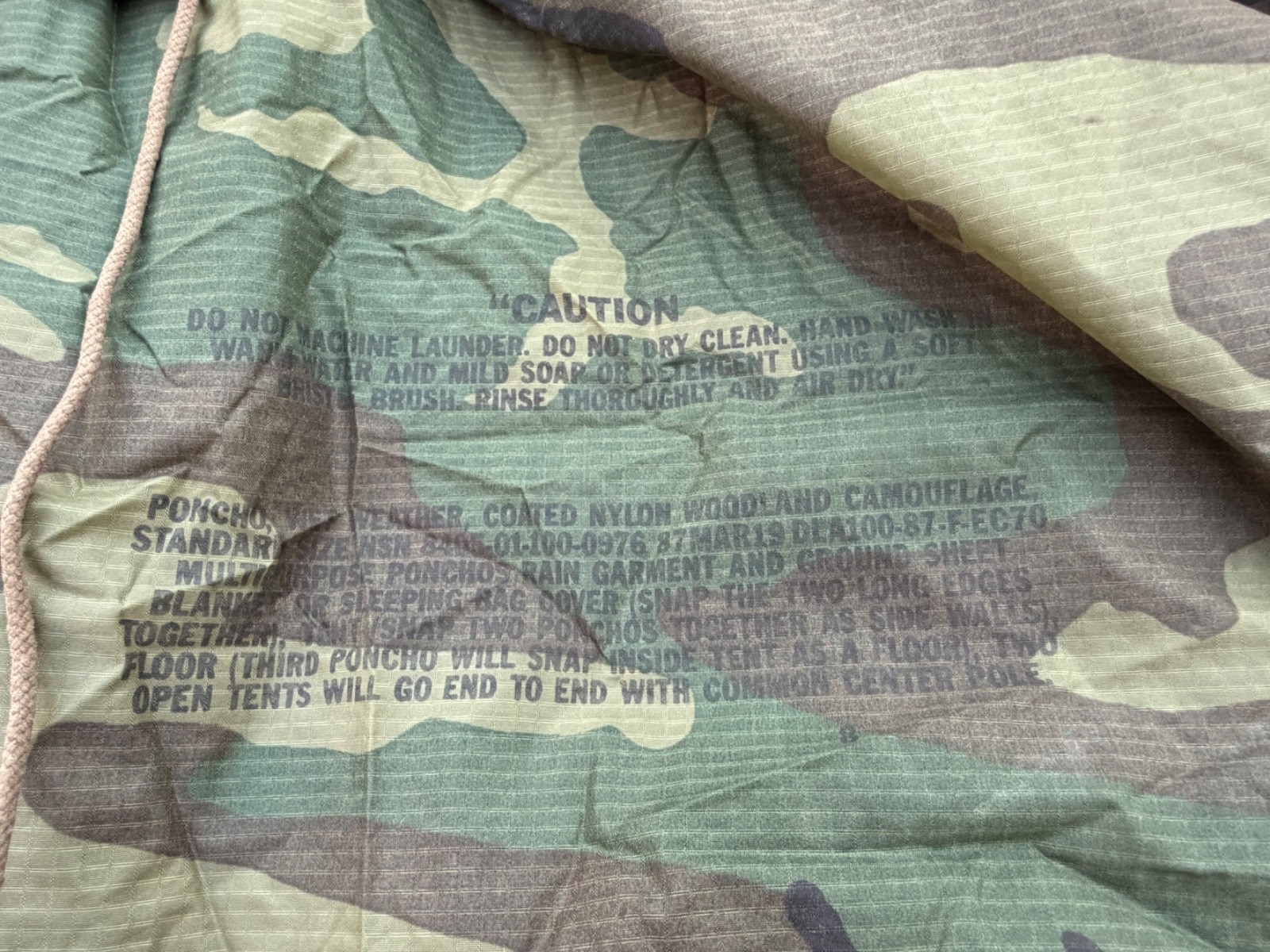 ORIGINAL POST VIETNAM WAR US ARMY WOODLAND CAMO RAIN PONCHO- DATED 1987