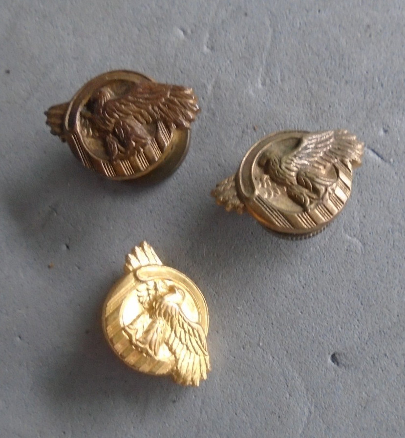 WWII screwback ruptured duck pins, one missing screw