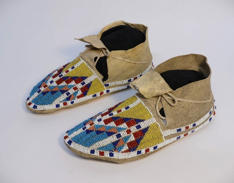 Antique Sioux Moccasins, painted parfleche interior soles