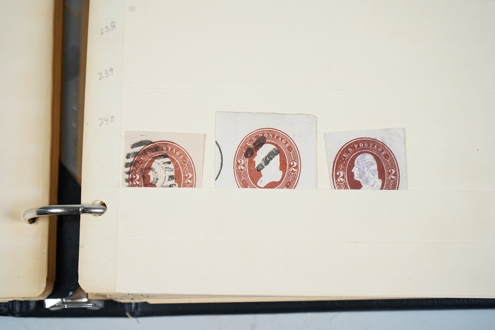 US COLLECTION OF 1,200+ STATIONERY CUT SQUARE STAMPS STORED IN STOCKBOOK