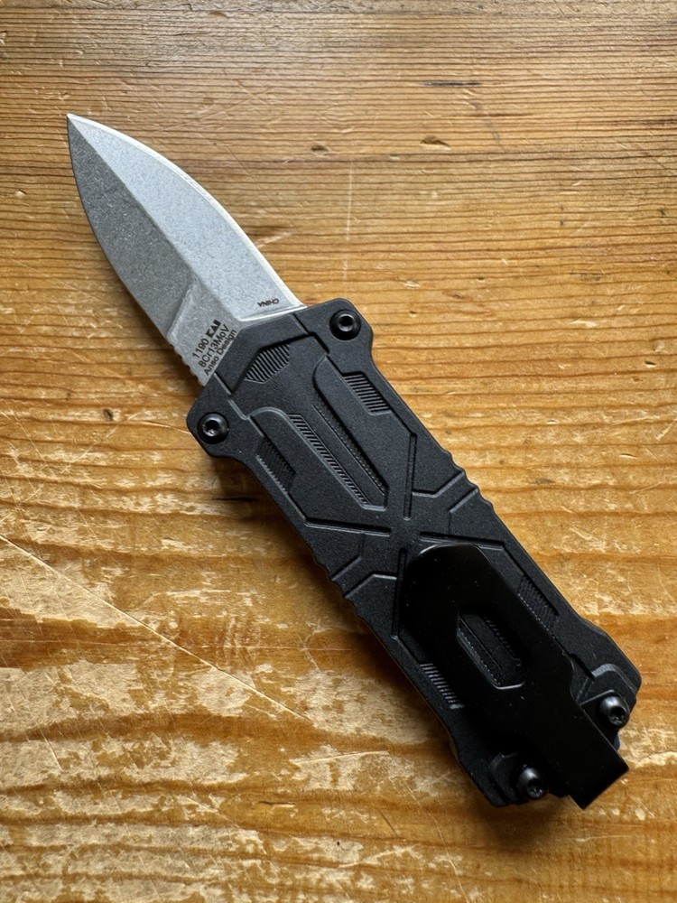 Kershaw Kapsule Manual Open Sliding Button Lock Single Edge Spear Point Blade