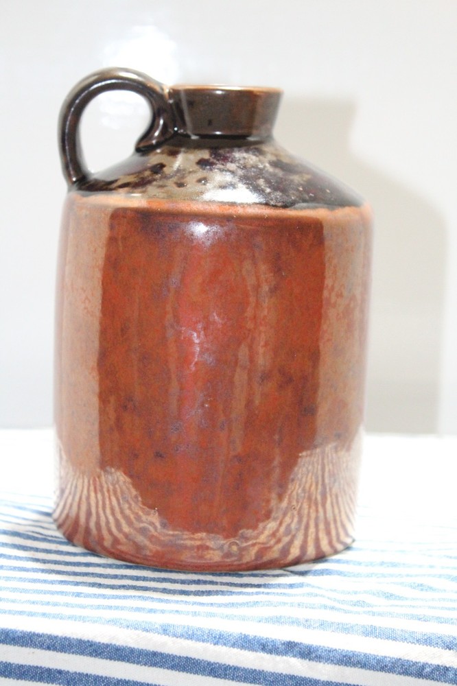Brown Jug with Handle and a Chicken Design