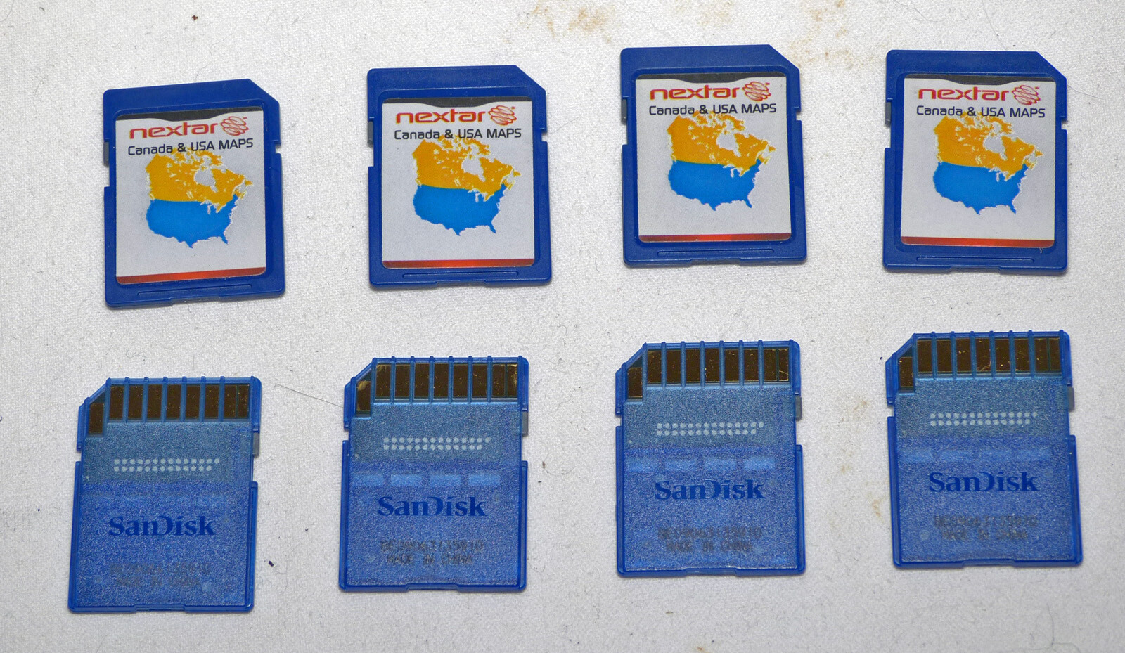 One (1) genuine Sandisk 2GB SD card with Nextar gps USA & Canada maps