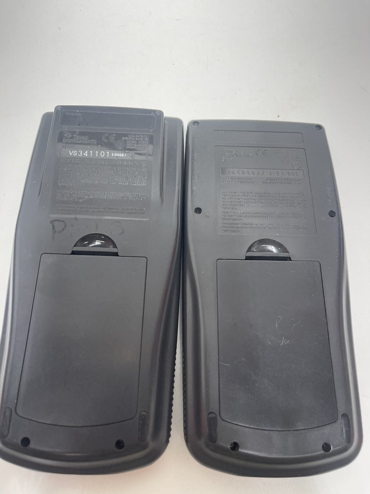 2 Texas Instruments TI-83 Graphing Calculators With Covers