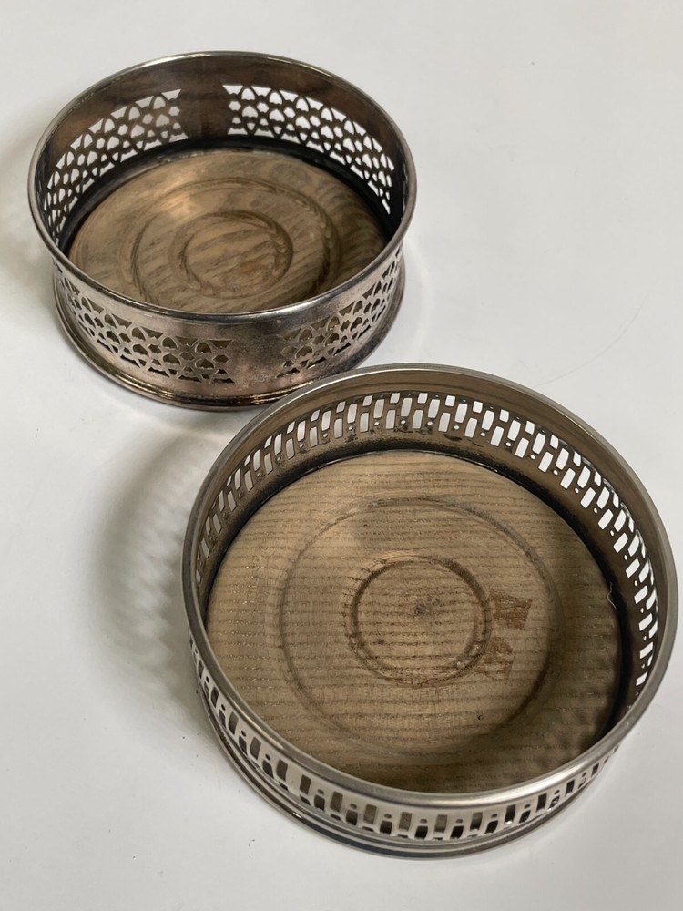 2 Silver Plated Bottle Caster Set Wood Base