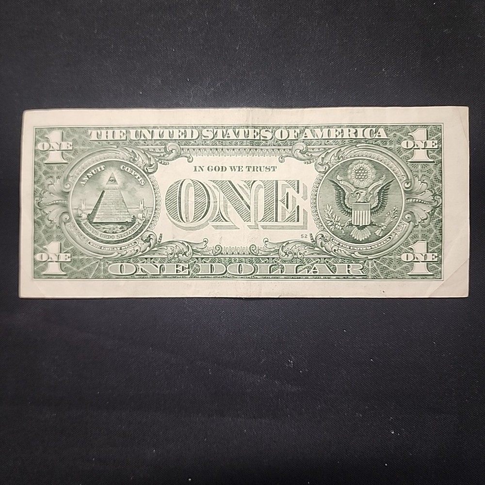 ERROR MISALIGNED MISCUT. ONE DOLLAR BILL