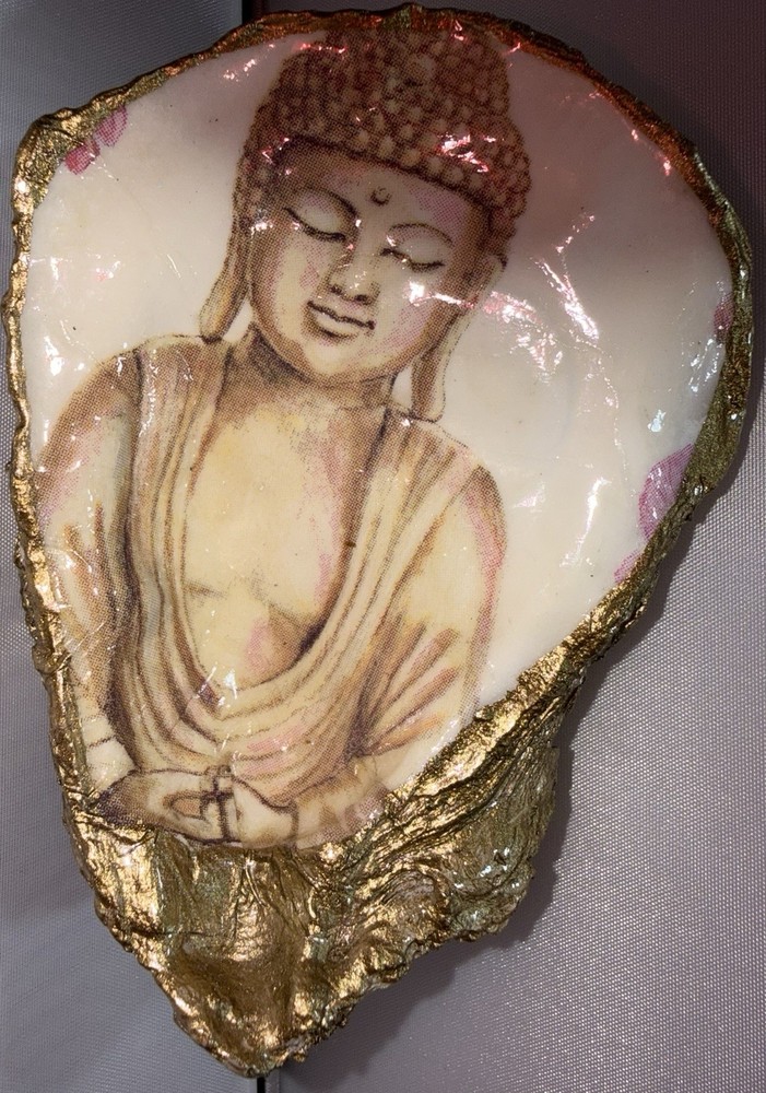 Decoupaged oyster shell ring dish featuring a Buddha image with gold-leaf edging