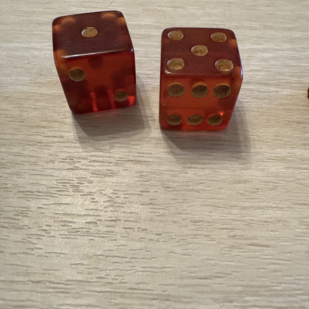 TWO pair of cherry bakelite translucent dice