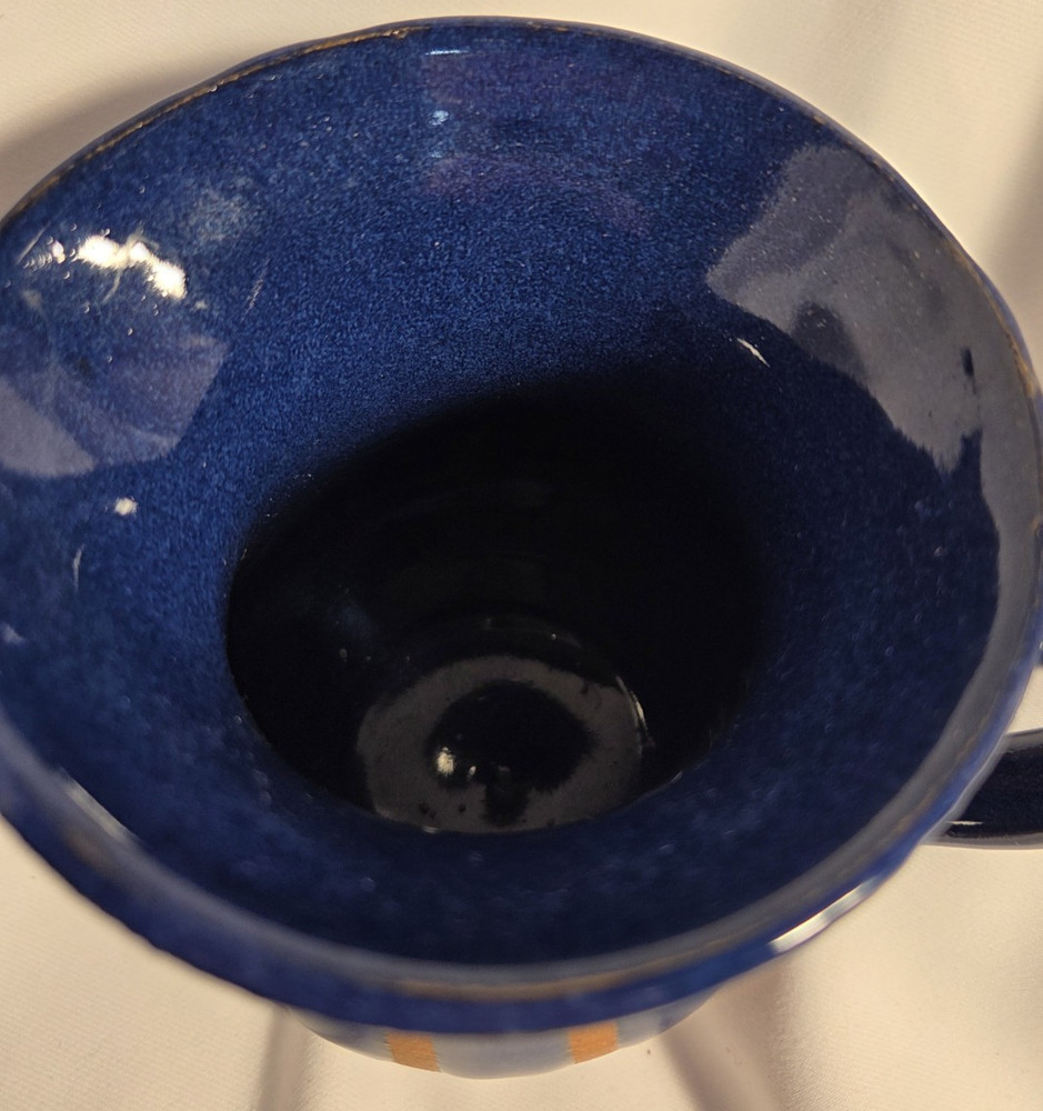 Pottery pitcher 2 toned with handle.