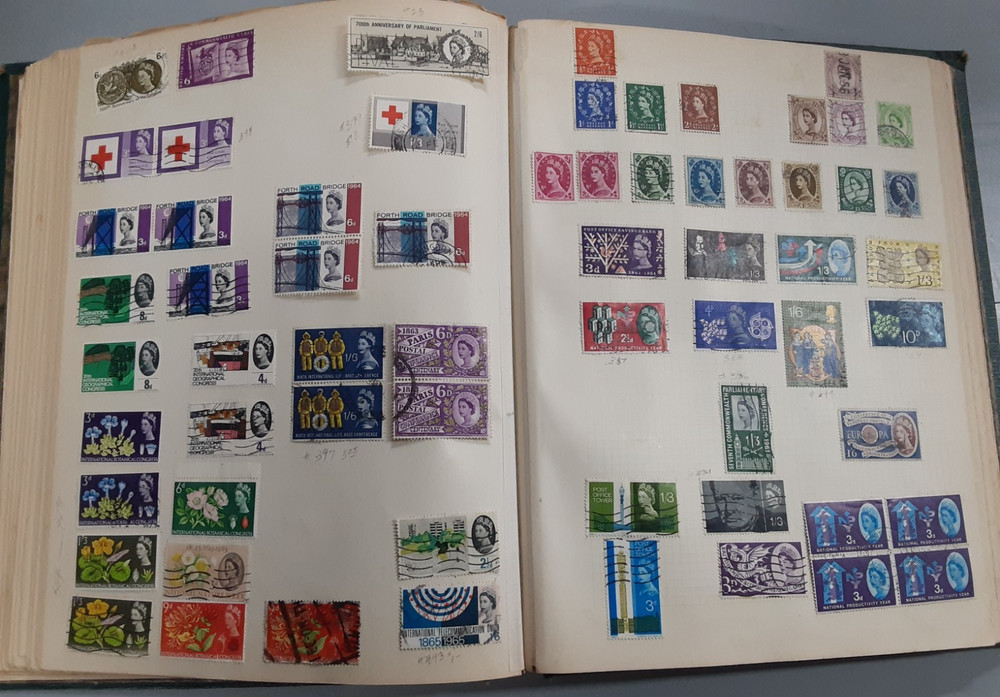 850+ World Wide stamps on quadrille pages in spring back cover