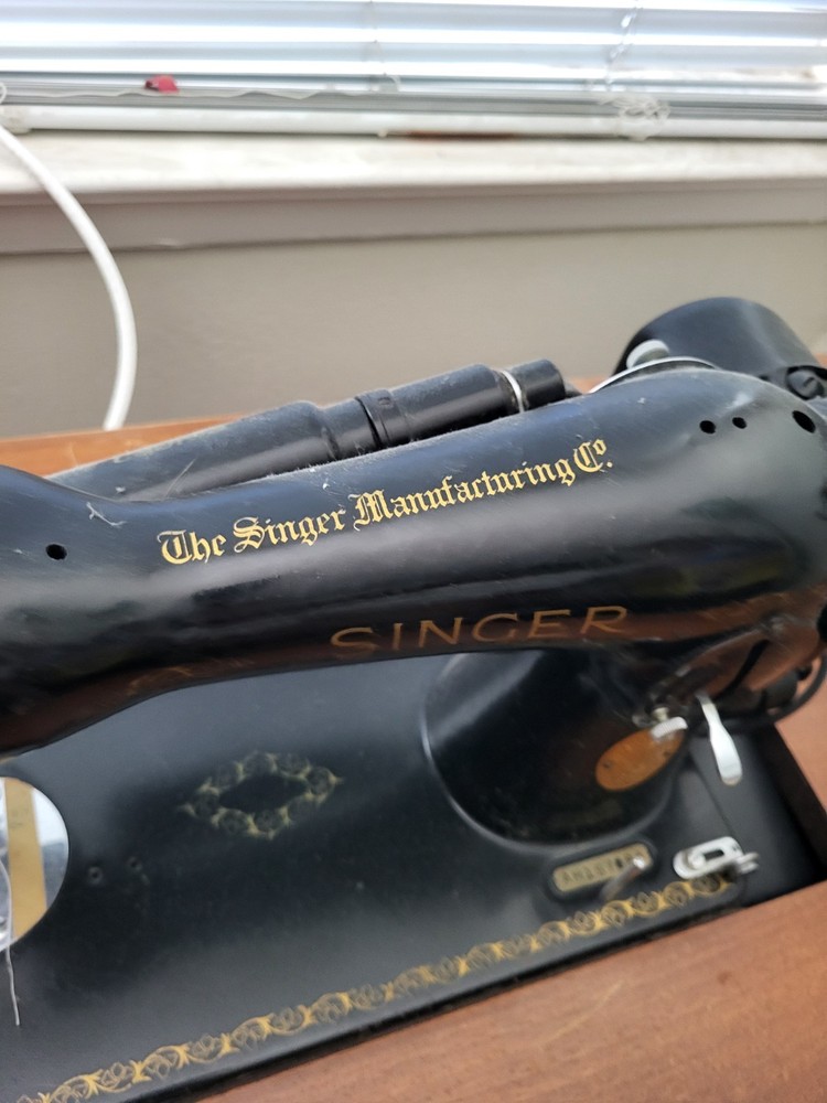 vintage SINGER sewing machine in cabinet