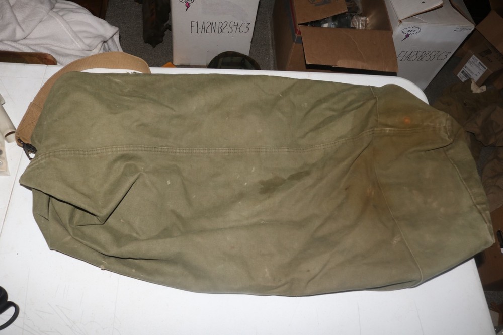 Original late WWII USMC marked transitional colored duffel bag named