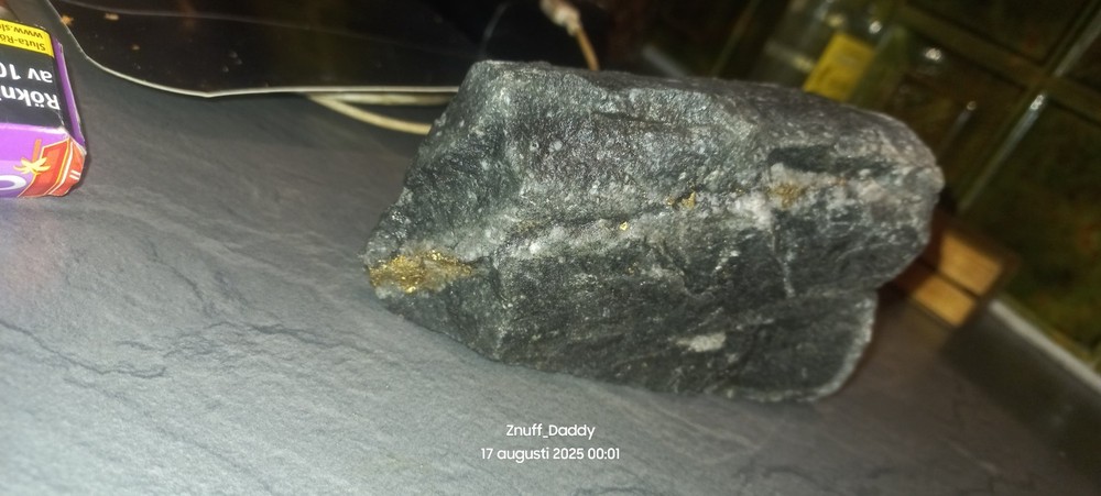 Precious metal bearing rock