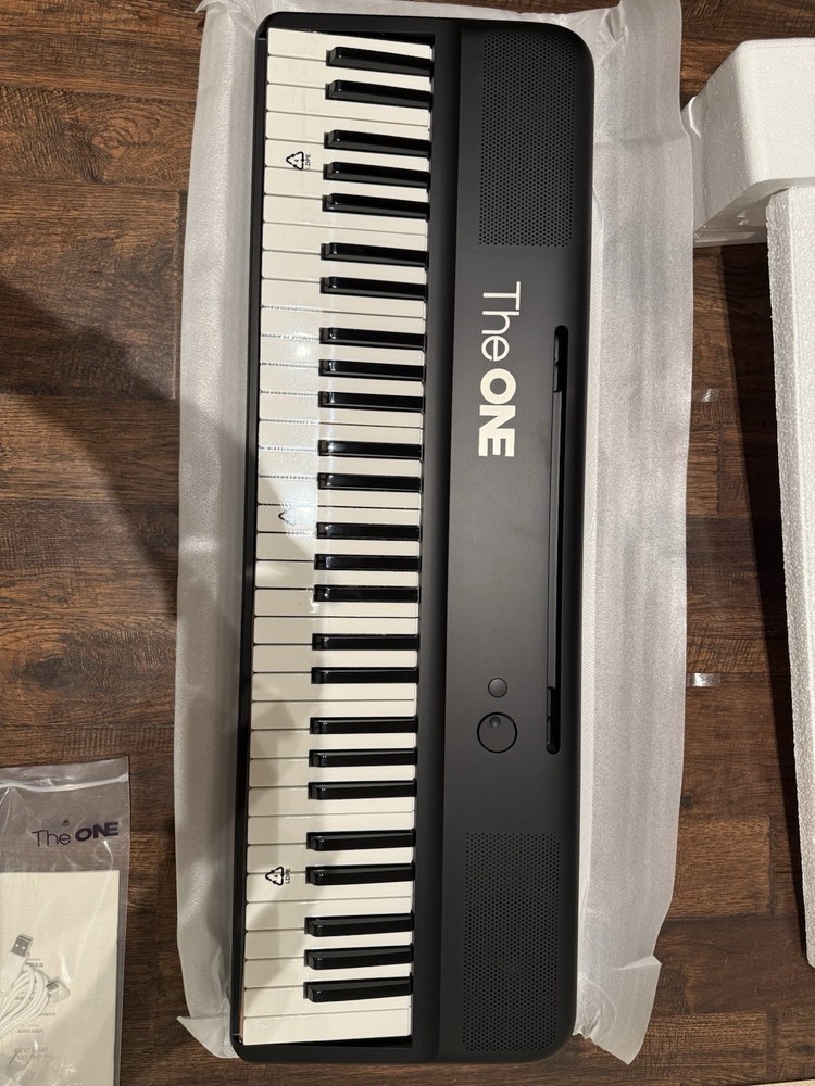 The ONE COLOR Smart Keyboard 61-Key Electronic Keyboard Bluetooth LED Learning