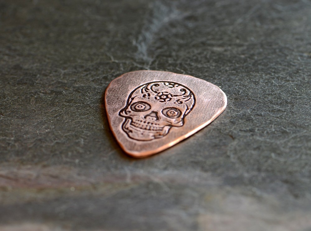 playable copper guitar pick with sugar skull - NicisPicks Original