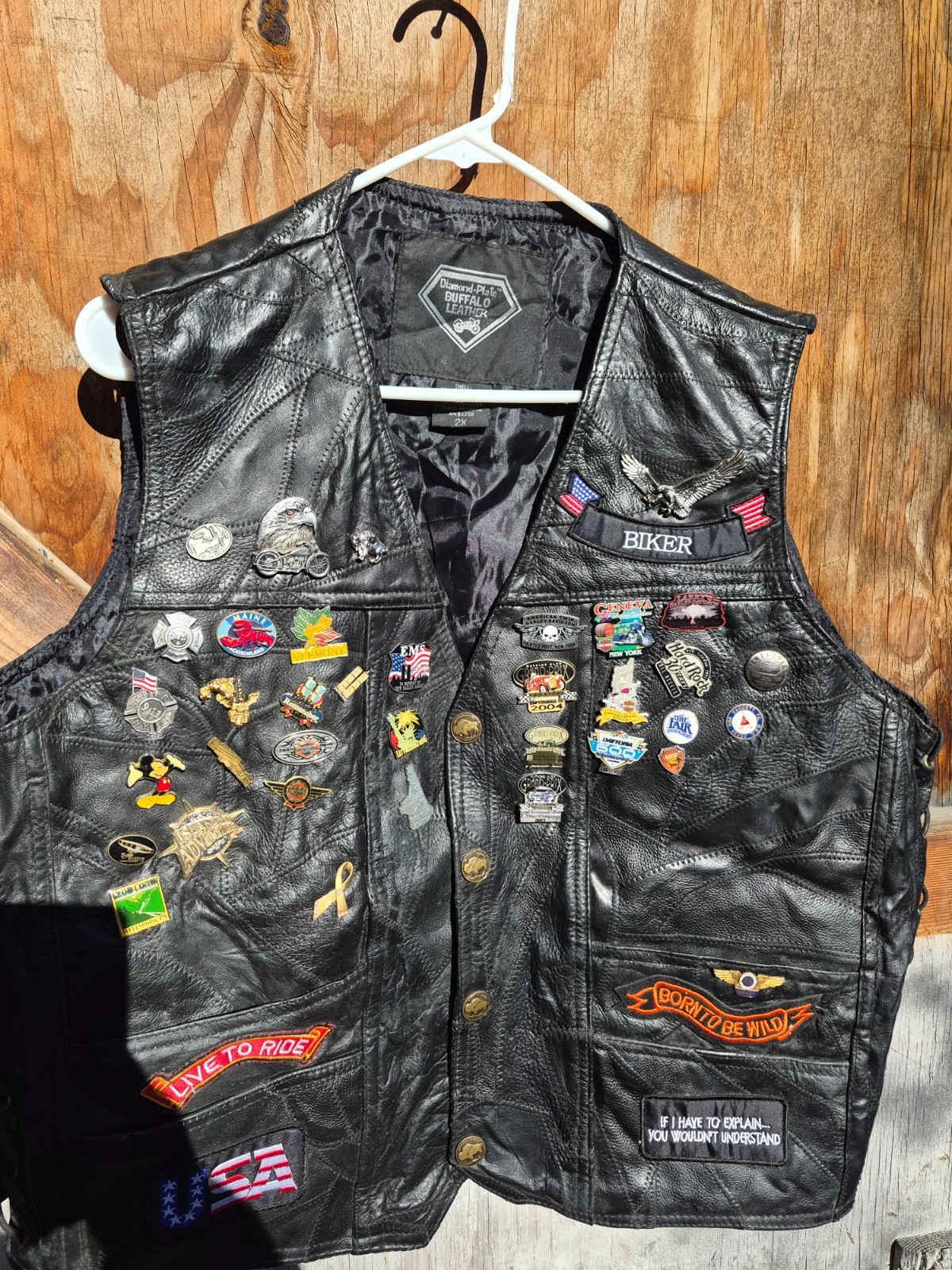 Vintage harley hog leather vest filled with pins and has patches 2xl