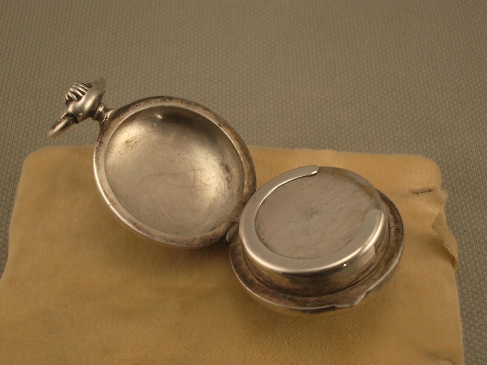 ANTIQUE SILVER COIN HOLDER