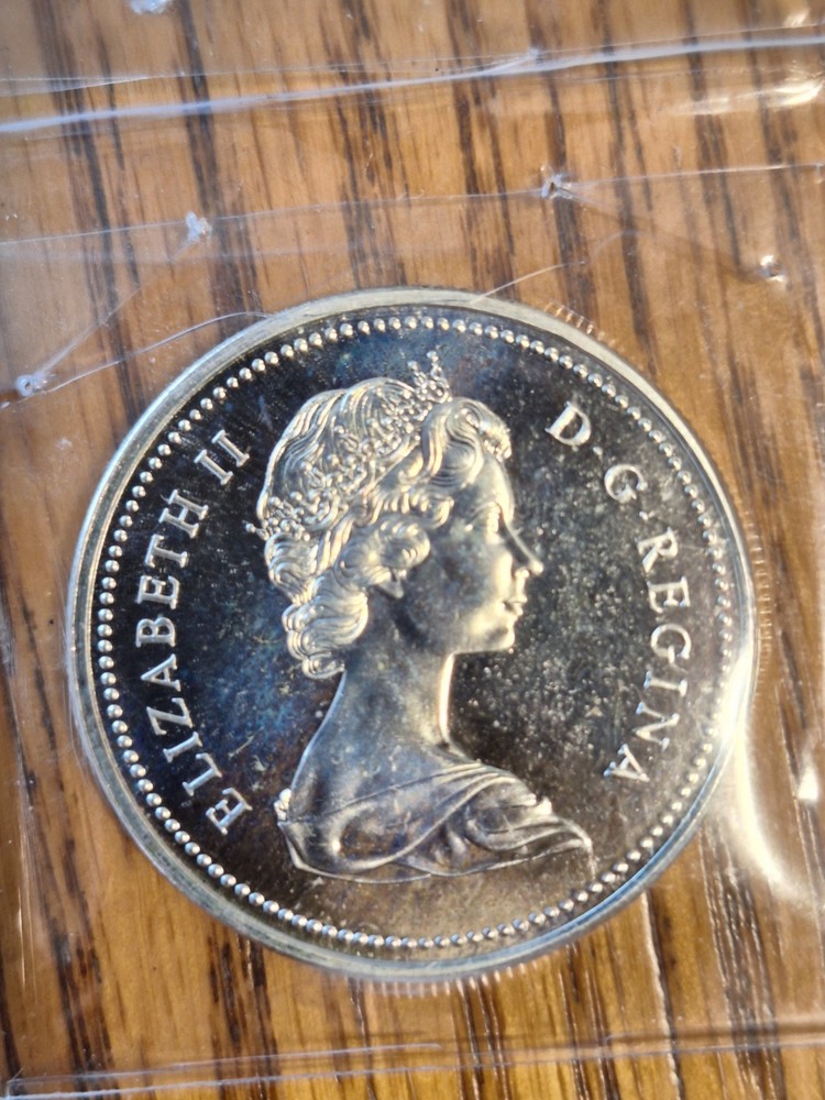 Rainbow Toned 1973 Canada RCMP Uncirculated Silver Dollar