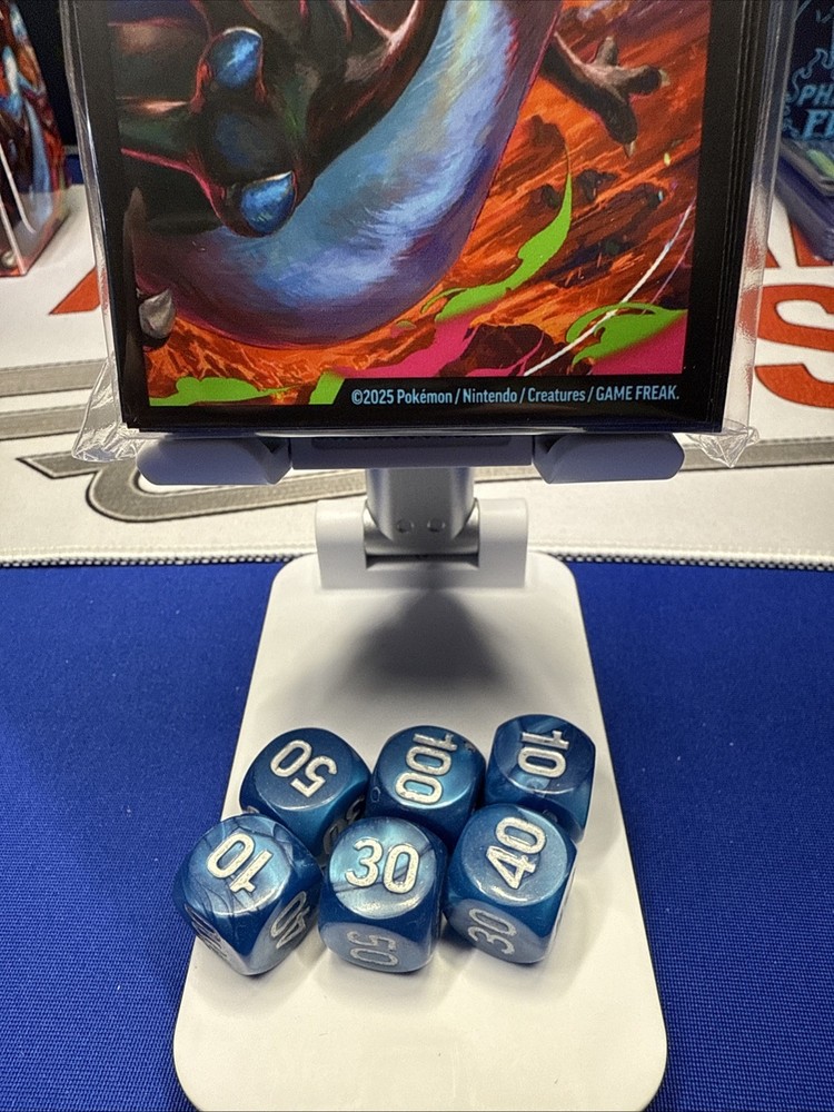 Sealed Mega Charizard UPS Sleeves and Unplayed Dice