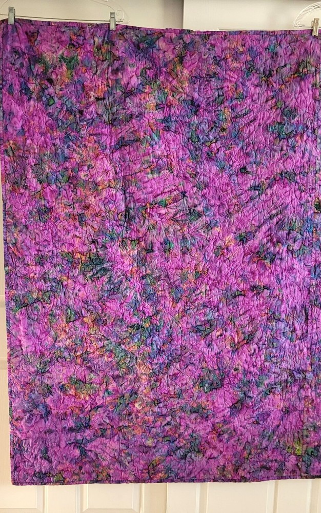 Hand made 55" X 62" Quilt In multiple batiks, purple batik back. Patchwork