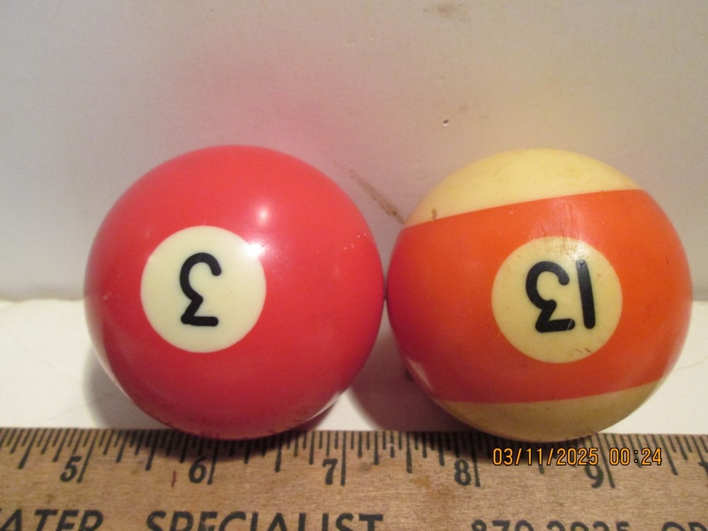 TWO [2] SPARE BILLARD BALLS.