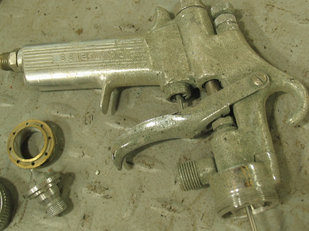 DEVILBISS Spray Gun with extra parts shown