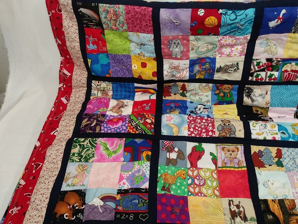 HANDMADE QUILT CHILDRENS 35”x52” multi character