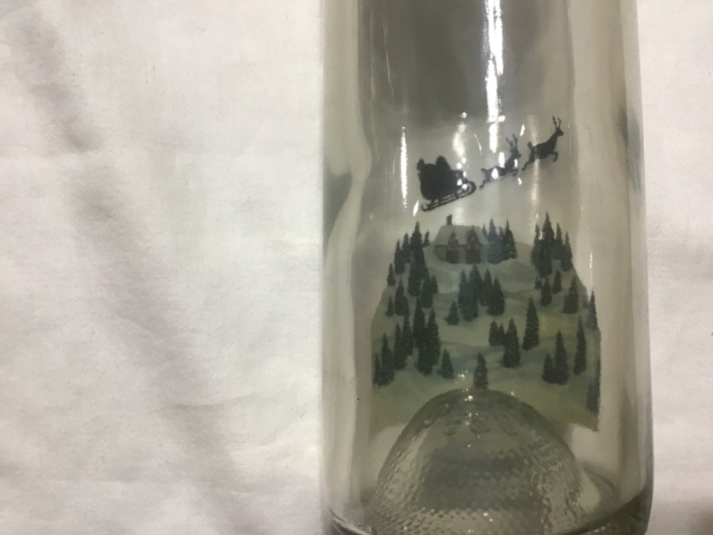 Christmas themed empty Chateau St. Nicholas wine bottle