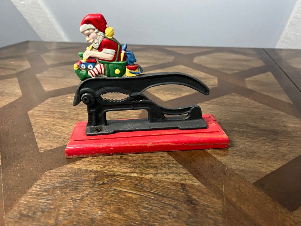 Old Fashioned Nutcracker Cast Iron on Wood Base santa theme nutcracker vintage