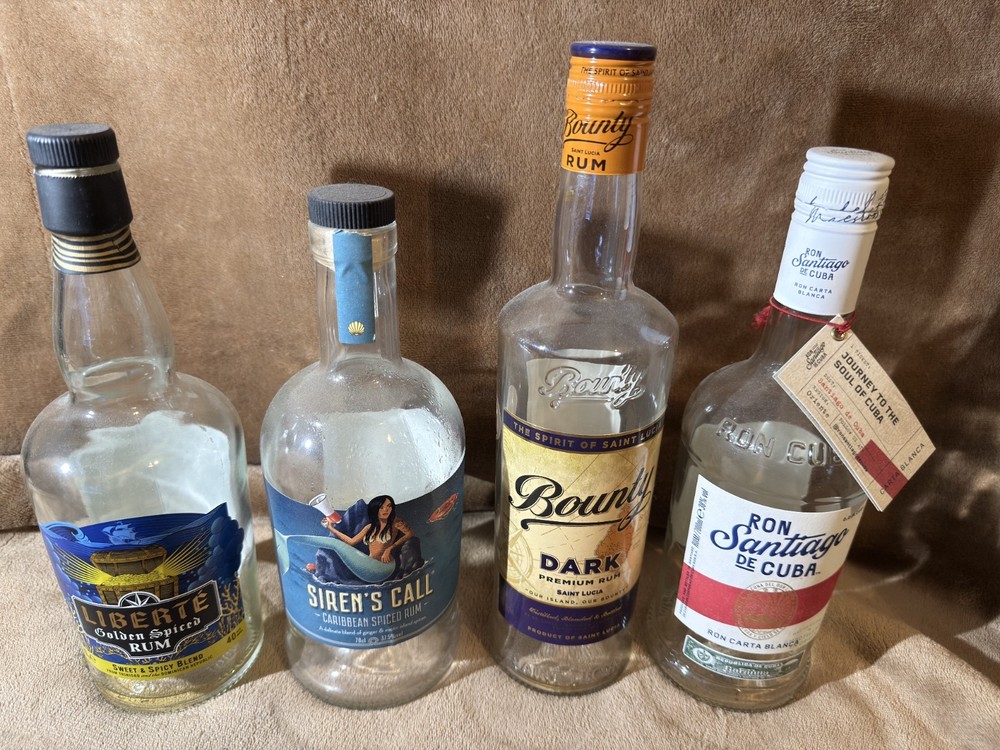 4 EMPTY RUM BOTTLES MIXTURE