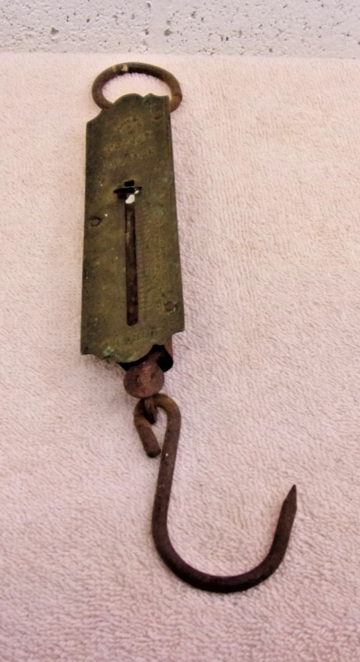Antique German pocket balance scale with hook and hanging ring.