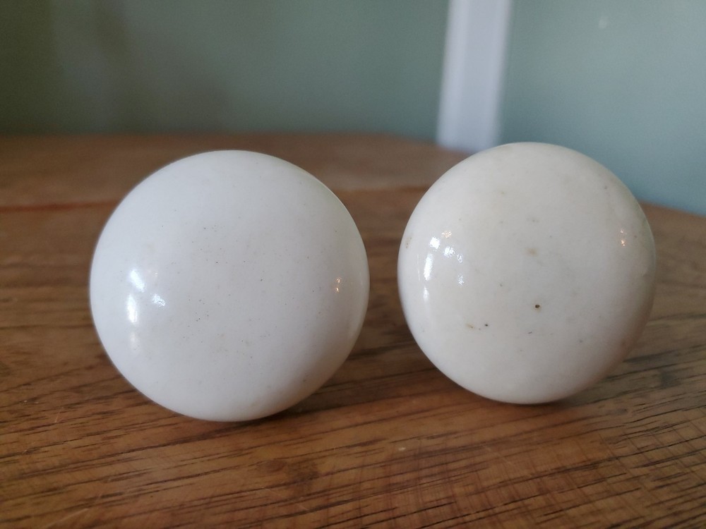 Two Antique Victorian White Porcelain Door Knobs With Iron Stem