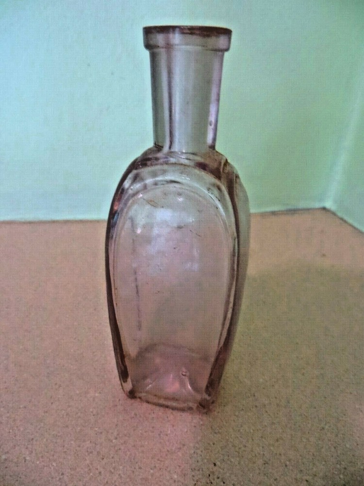 APPLIED LIP SIDE MOLD SEAMS TO BOTTOM SHEARED TOP UNKNOWN BOTTLE