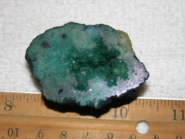 Geode cut & polished half with colored crystal center 2 inch E15