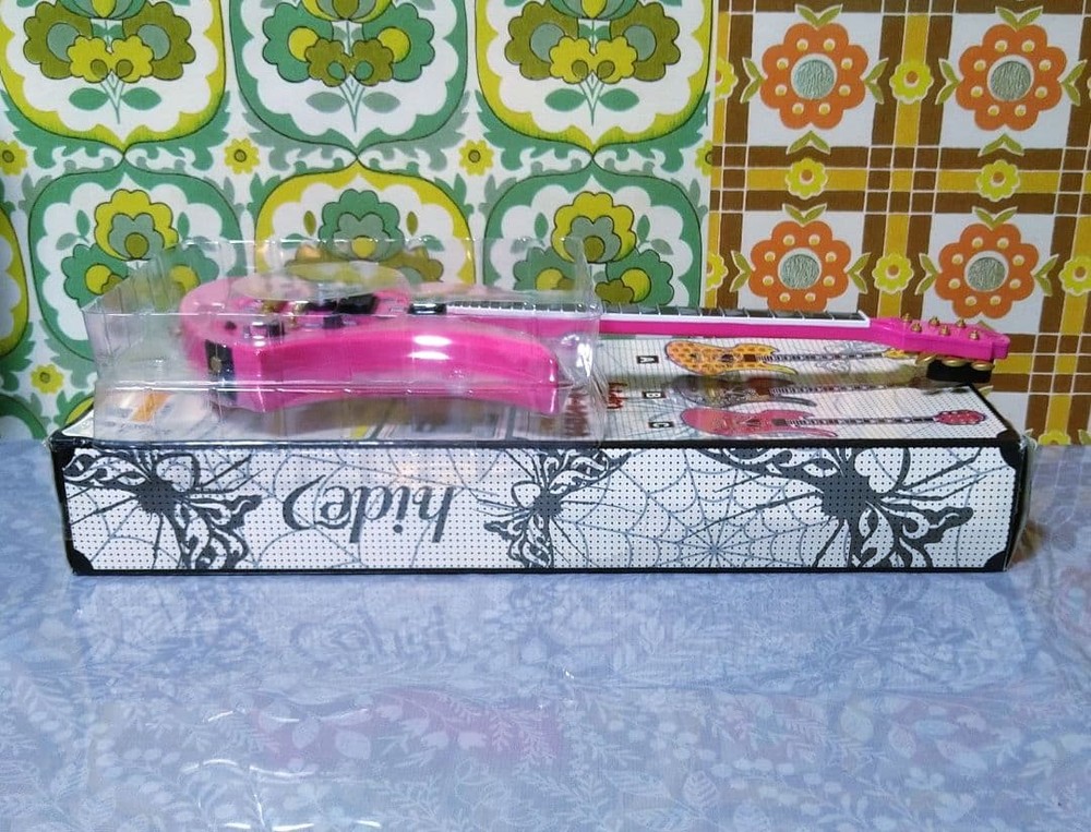 hide guitar wall clock pink