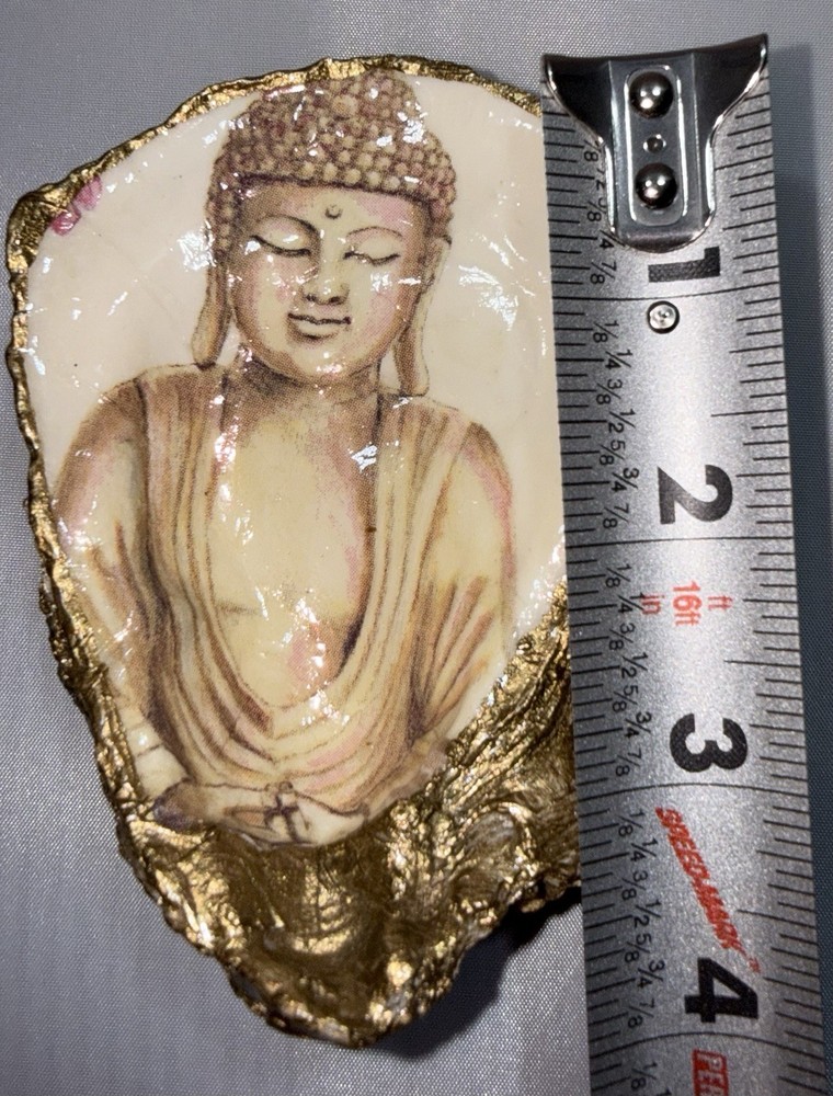 Decoupaged oyster shell ring dish featuring a Buddha image with gold-leaf edging