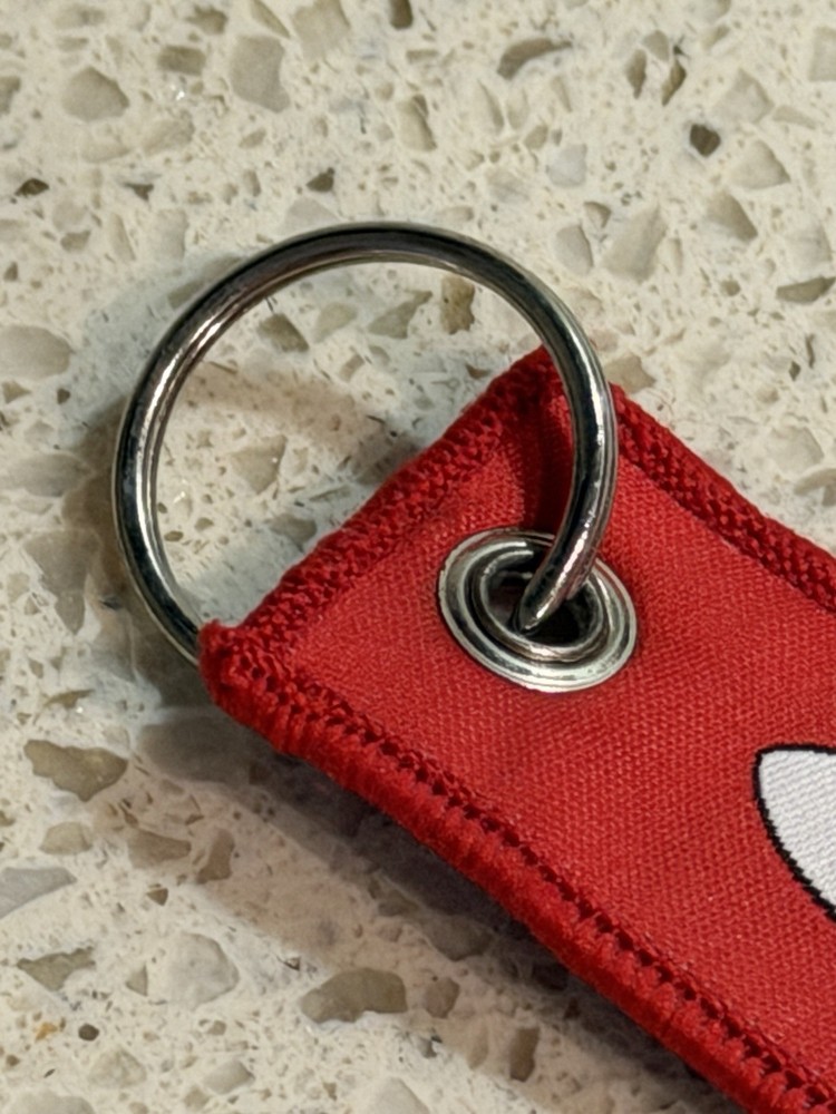 Pre-Owned Red SpaceX Falcon 9 Rocket Remove Before Flight Keychain Zipper Pull