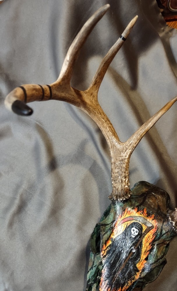 Painted European mount. 8 point, camo, grim reaper.