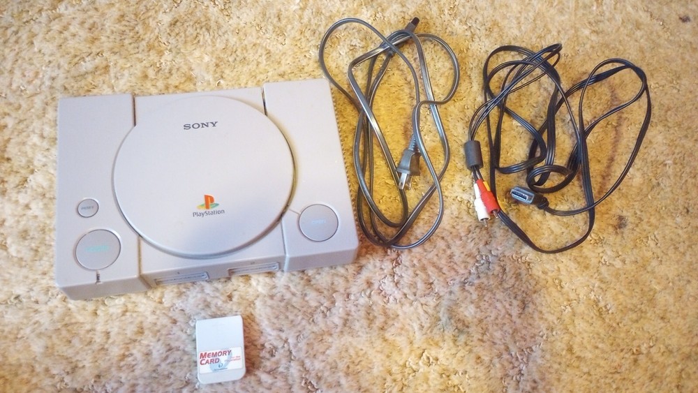PlayStation 1 console with games