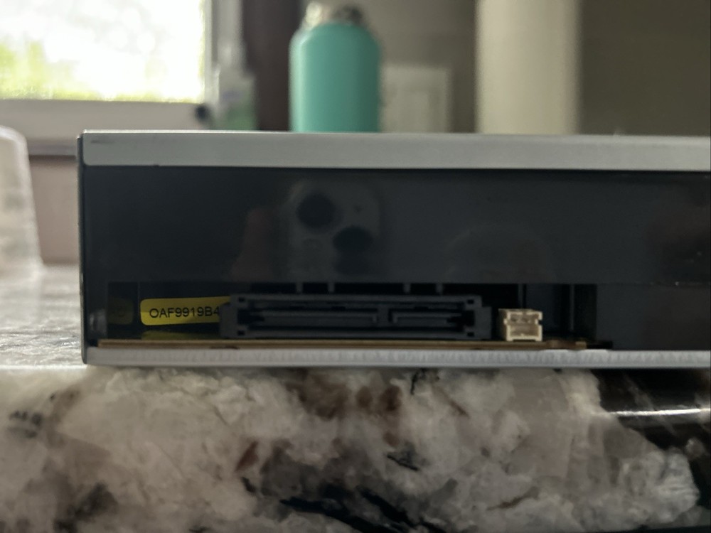 A Hitachi LG Data Storage Super Multi DVD Rewriter. Model GH4OL.