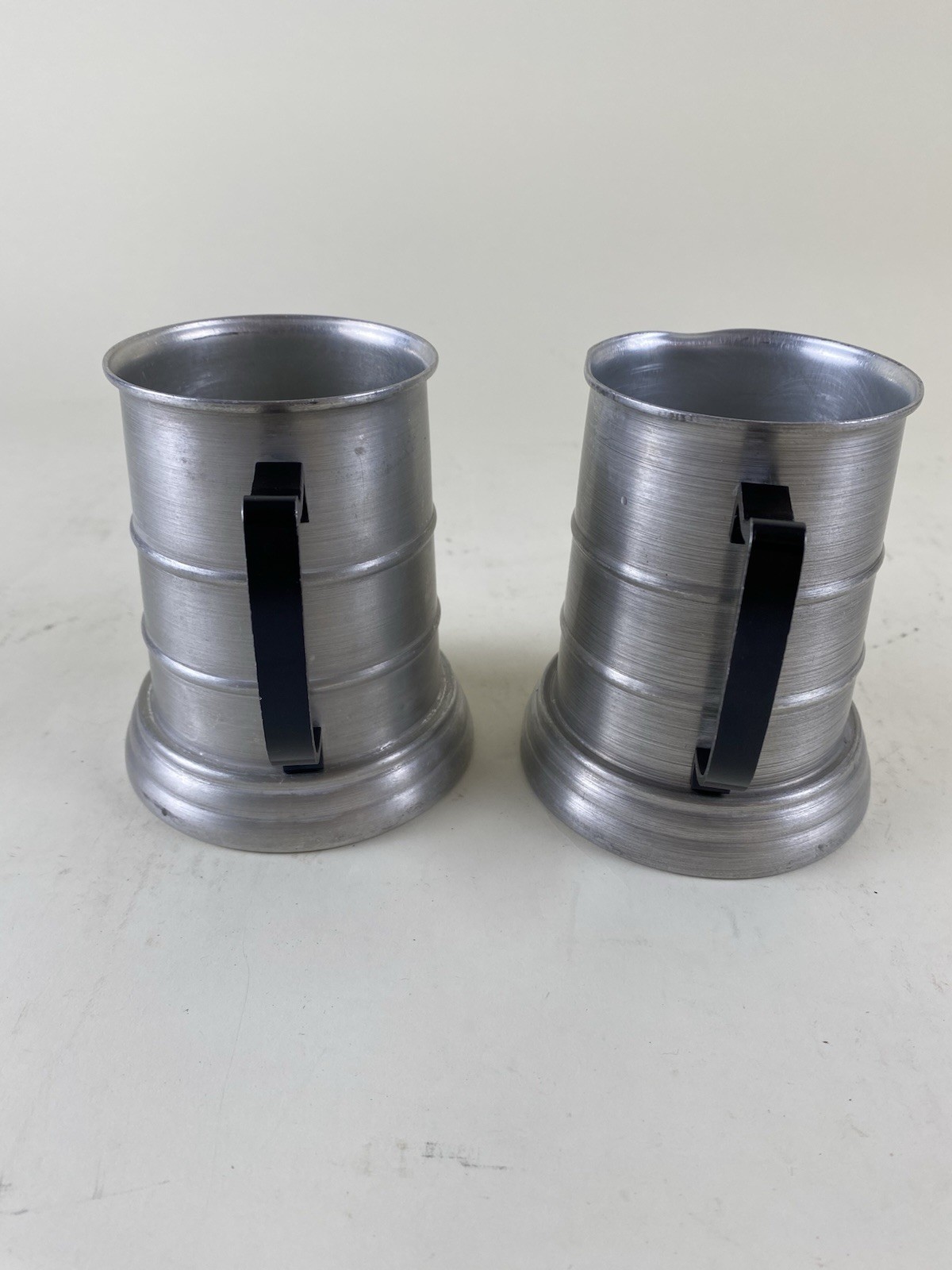 Pair Apex Aluminum Pewter Beer Steins Mugs w Glass Bottom Black Handle Hong Kong