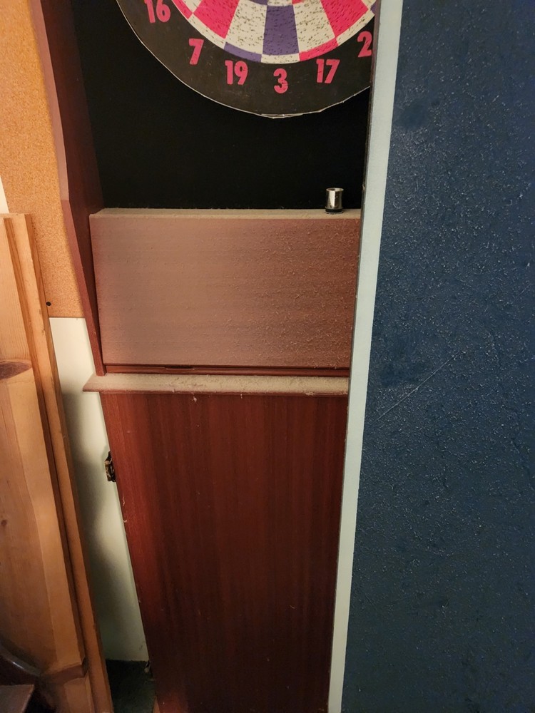 ping pong table and dart cabinet