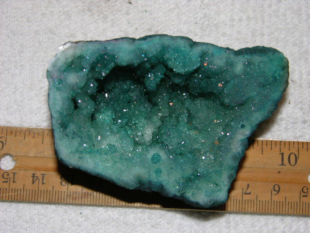 Geode cut & polished half with colored crystal center 3 inch E51