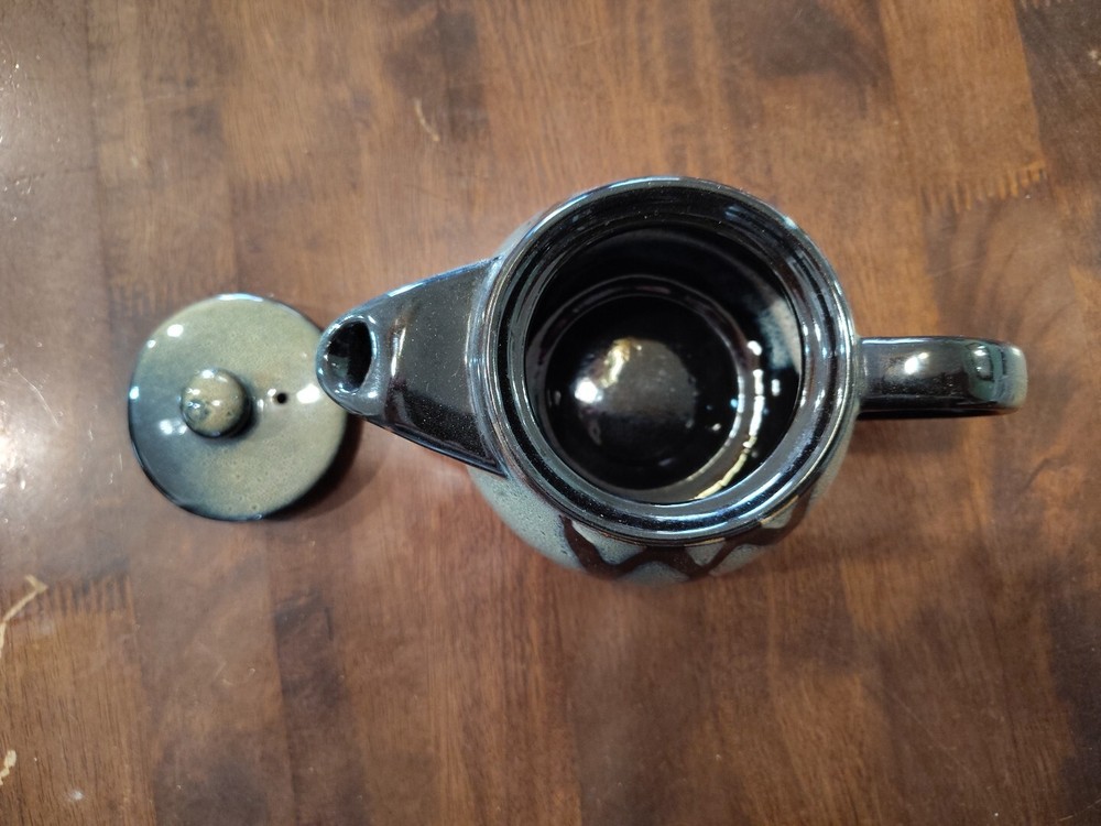 black with green ceramic teapot