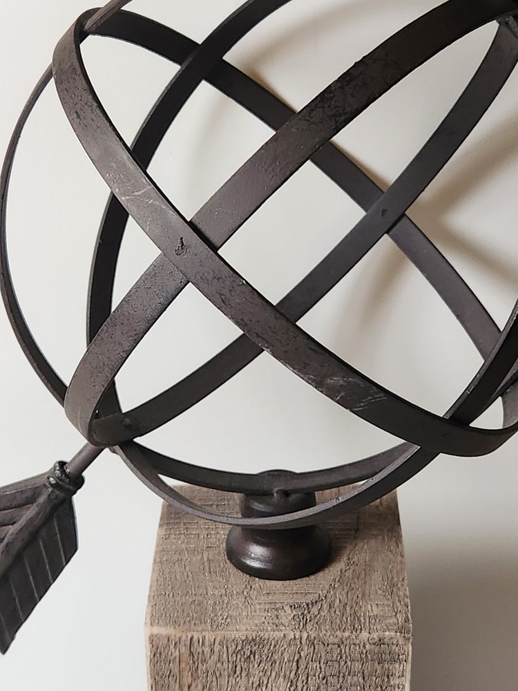 Metal Orb And Arrow Decor On Standing Base