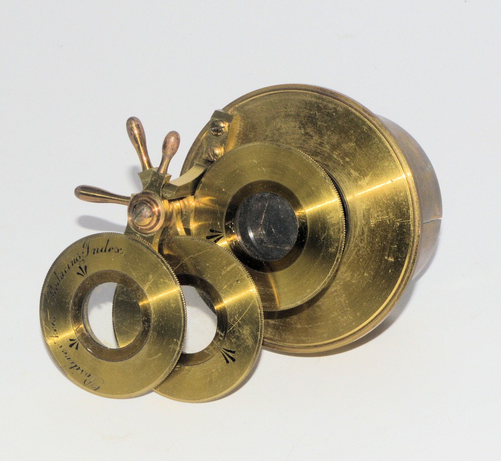 Very large binocular microscope in case with accessories.