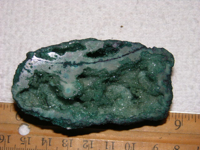 Geode cut & polished half with colored crystal center 3 inch E32