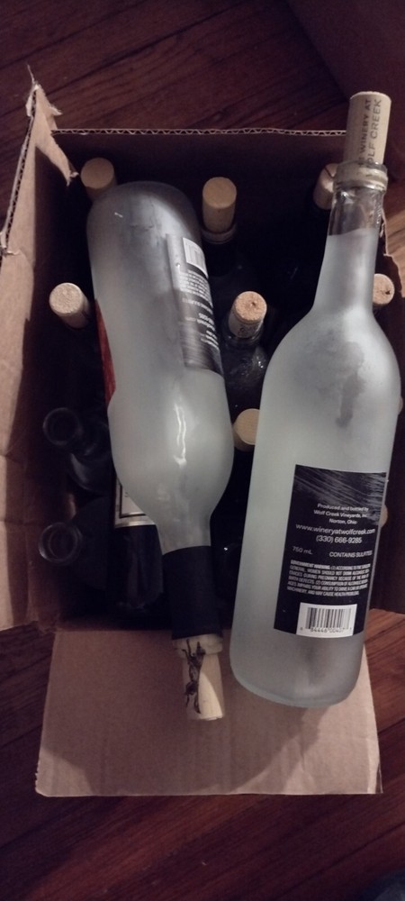 15 empty wine bottles