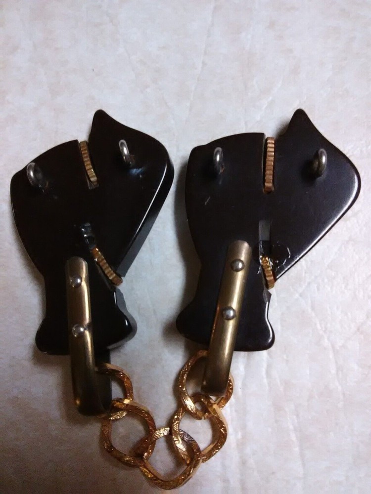 Bakelite group of 3 cloak / cape clasps
