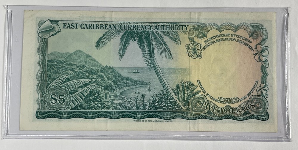 East Caribbean Currency Auth. $5 (#73) Nice Note with Light Circulation.